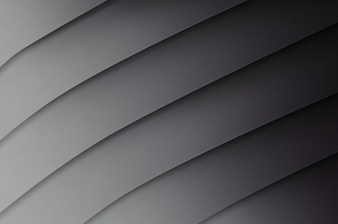Abstract diagonal paper folds in pale grey tones